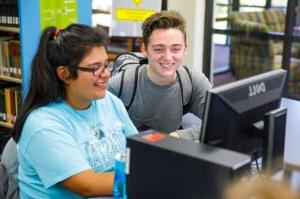 HSU students working studying together on a computer